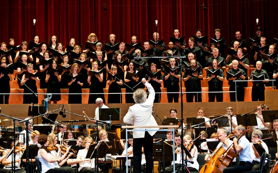 Conductor Carlos Kalmar leading the Grant Park Orchestra and Chorus on Jay Pritzker Pavilion Stage