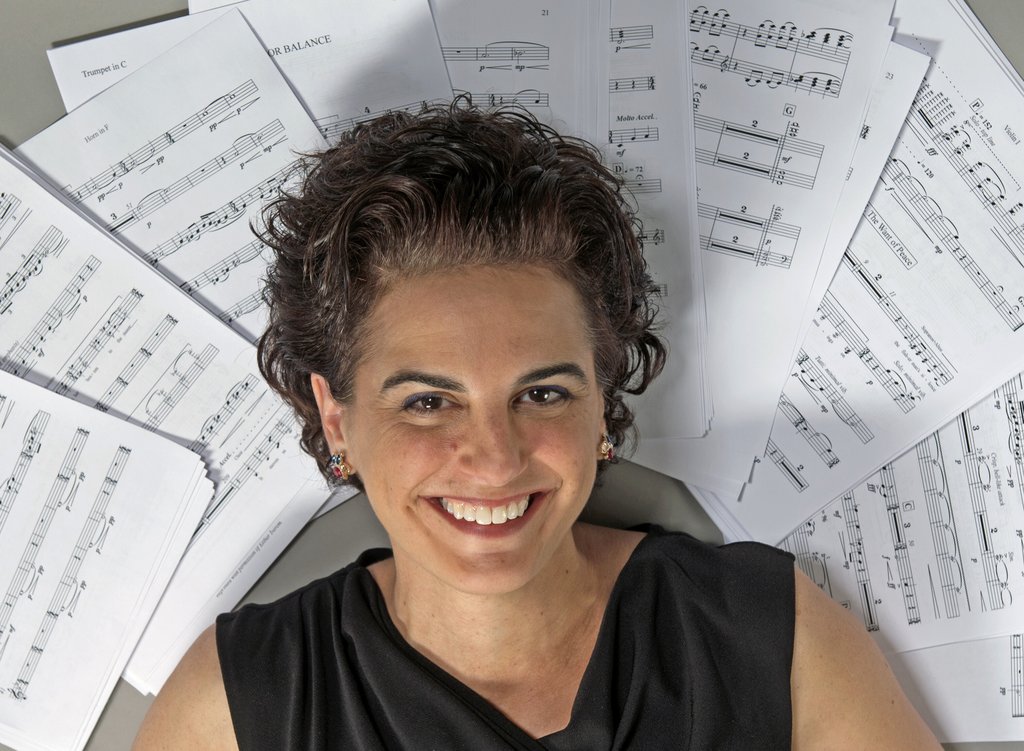 Stacy Garrop headshot with score around her head like a halo