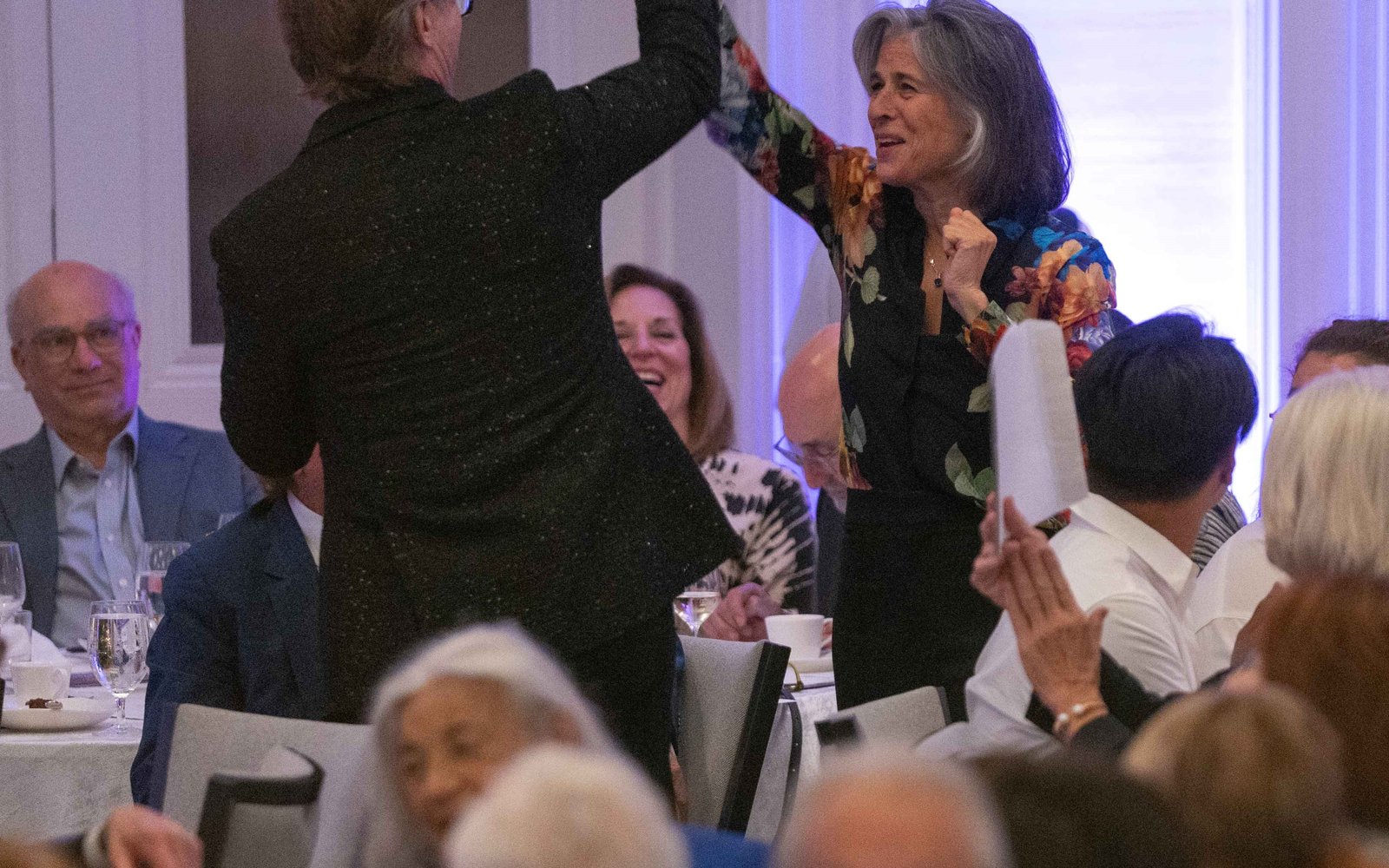 Event attendees during the evening's paddle raise